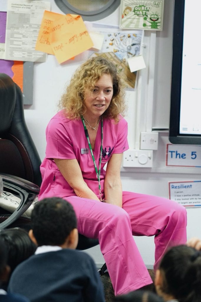 Danielle teacjing children at the local school